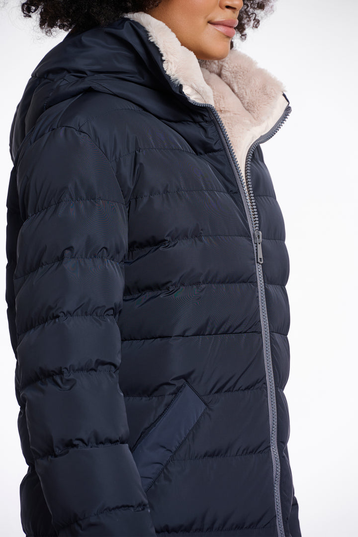 Navy puffer jacket with white sherpa lining on a white background